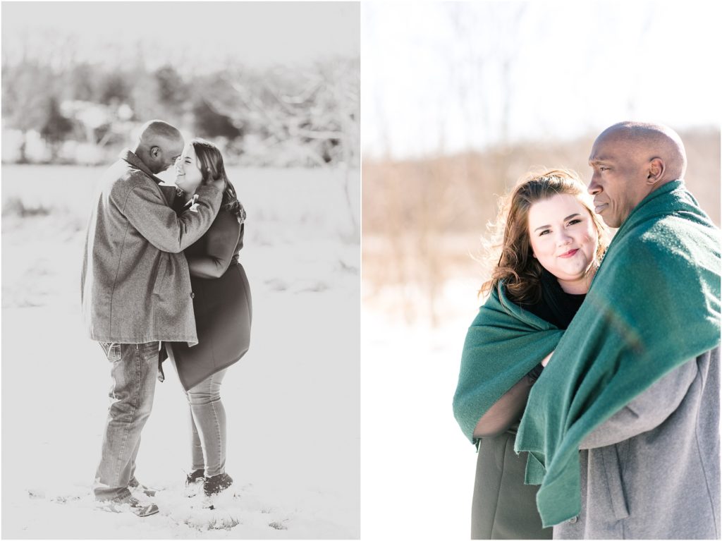 engagement photos of couple in the snow and wrapped up in a green blanket