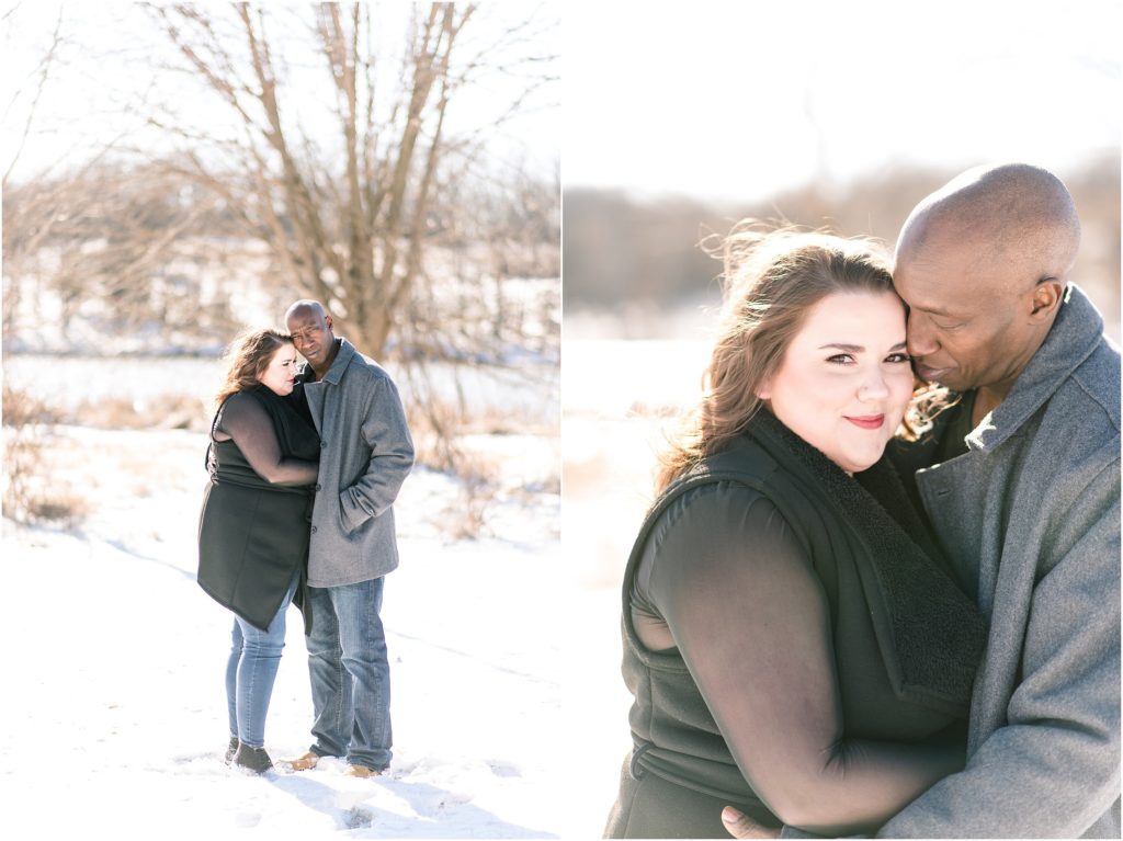 binder park engagement session in the snow with couple wearing black and jeans 