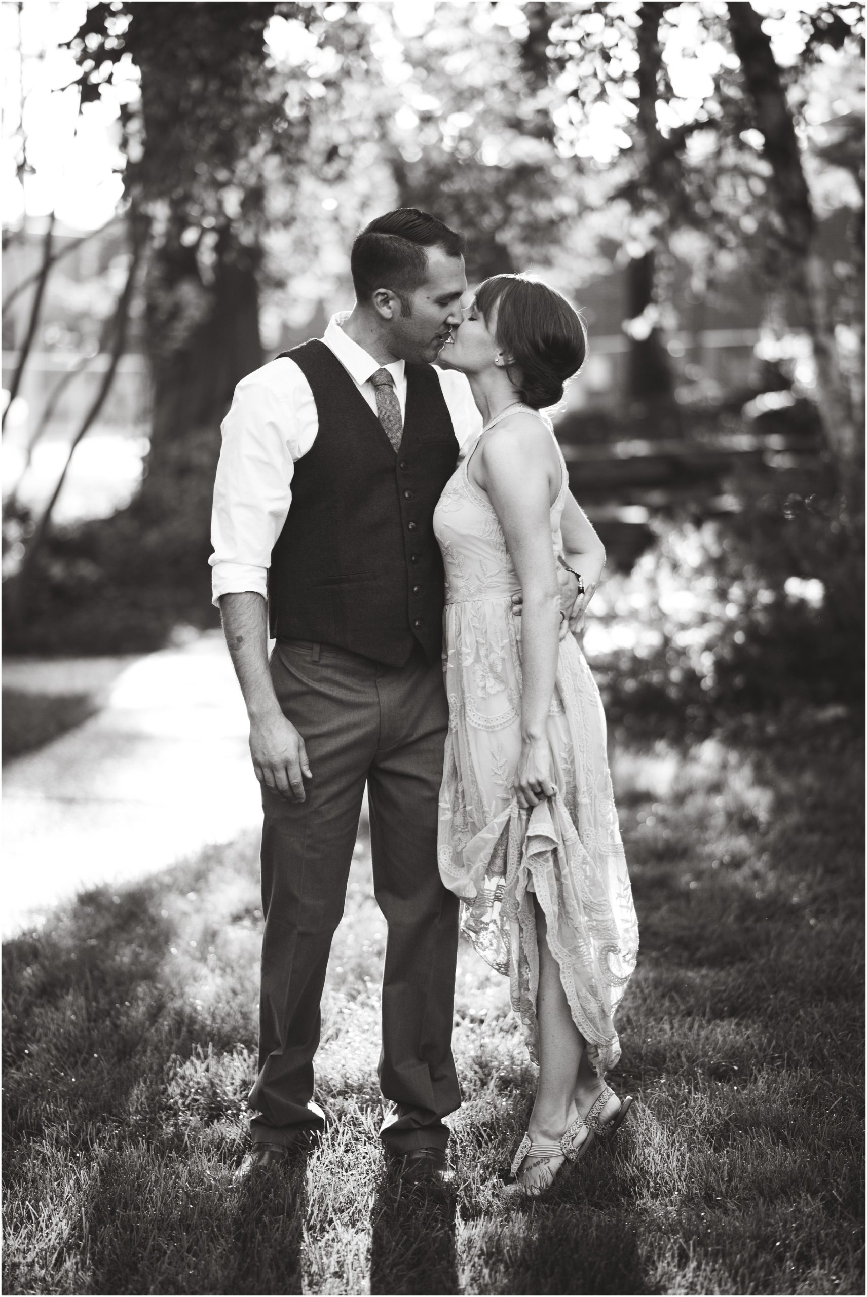 engaged couple kissing in shelter gardens in black and white