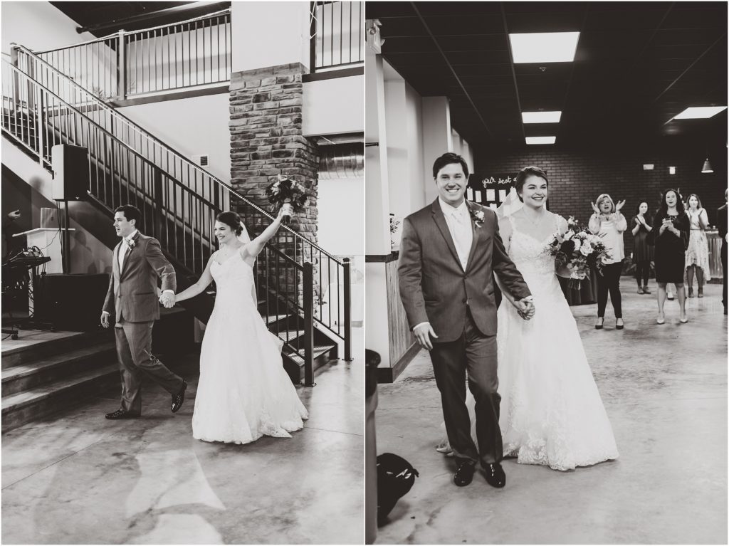 black and white photo of bride and groom entering capital bluffs event center wedding ceremony