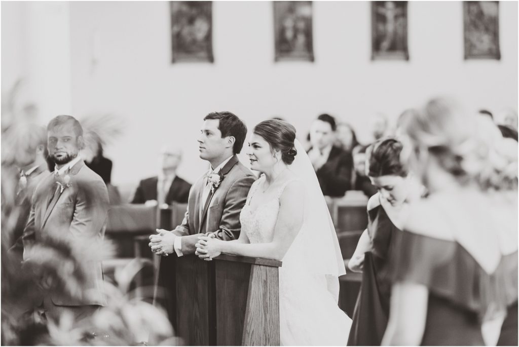 st. andrews church wedding ceremony black and white bride and groom praying