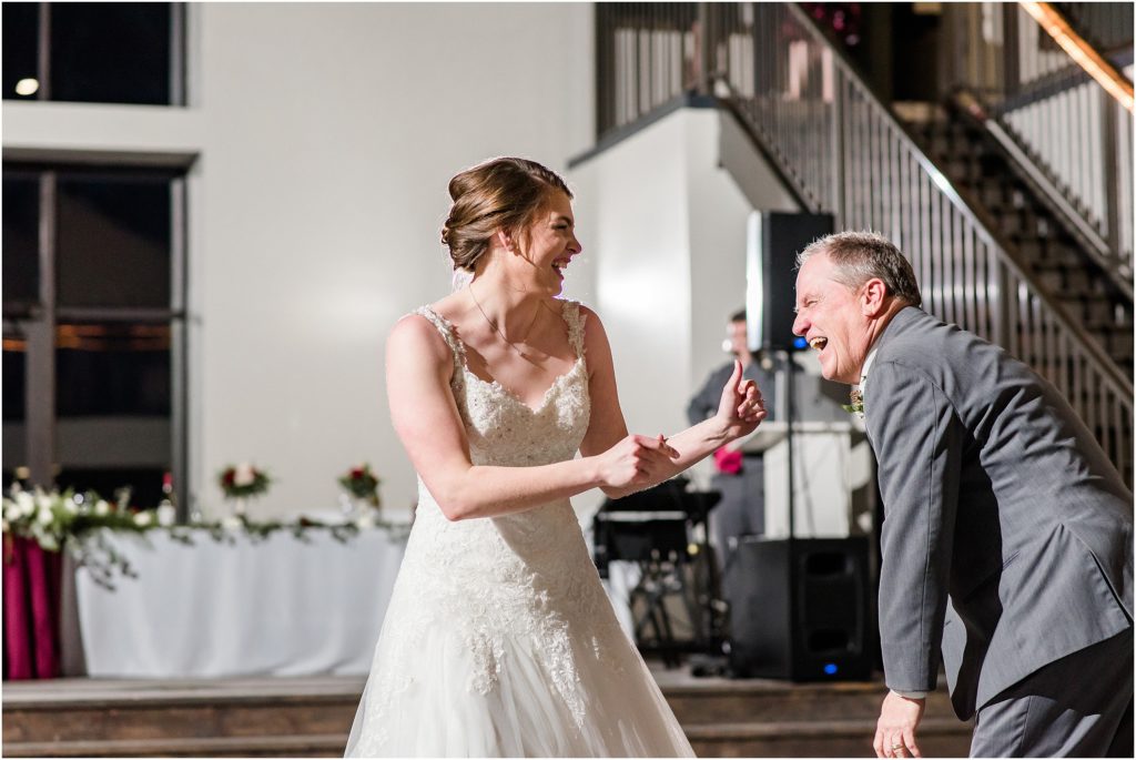 bride and her dad laughing during their first dance