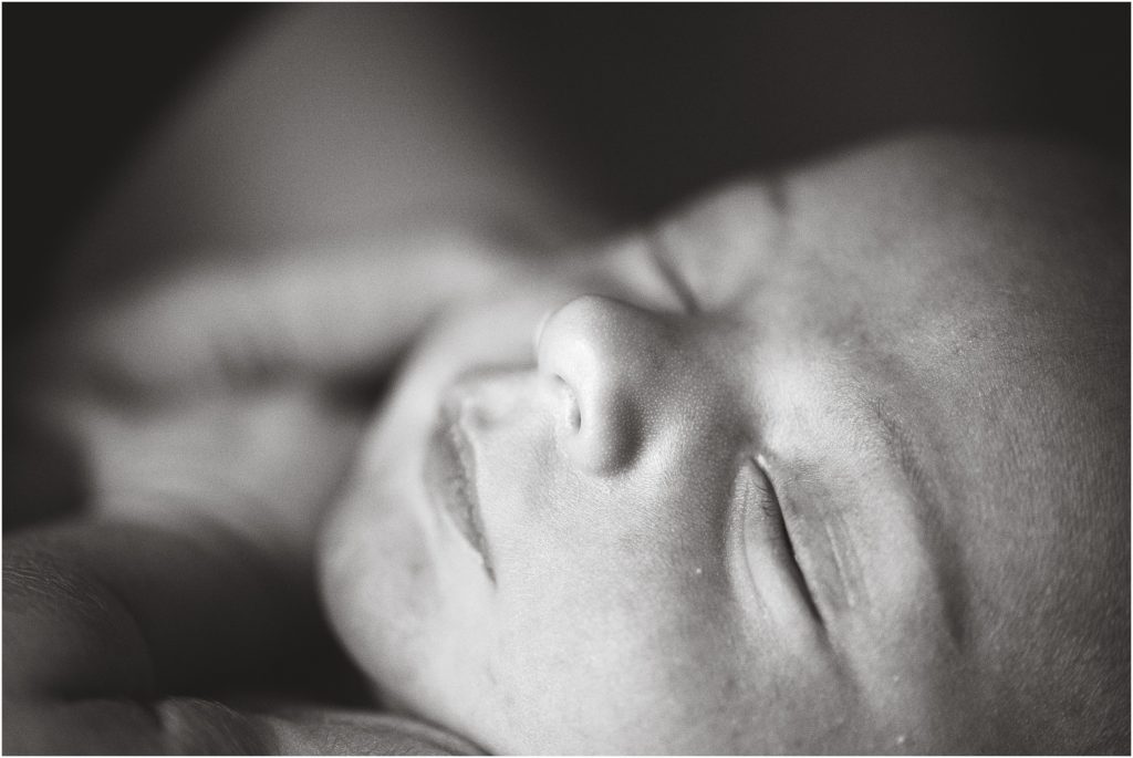 black and white image of newborn baby boy nose and eye details