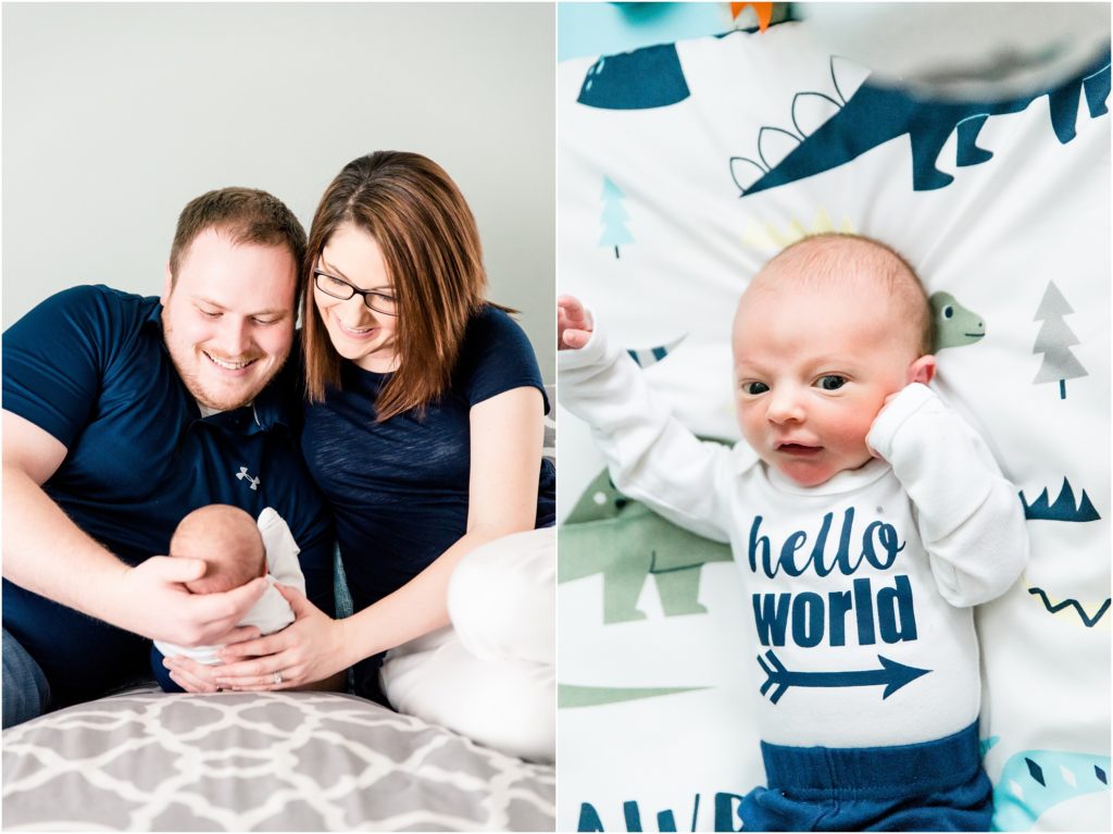 mom and dad smiling at baby boy in navy shirts baby boy with hello world onesie on