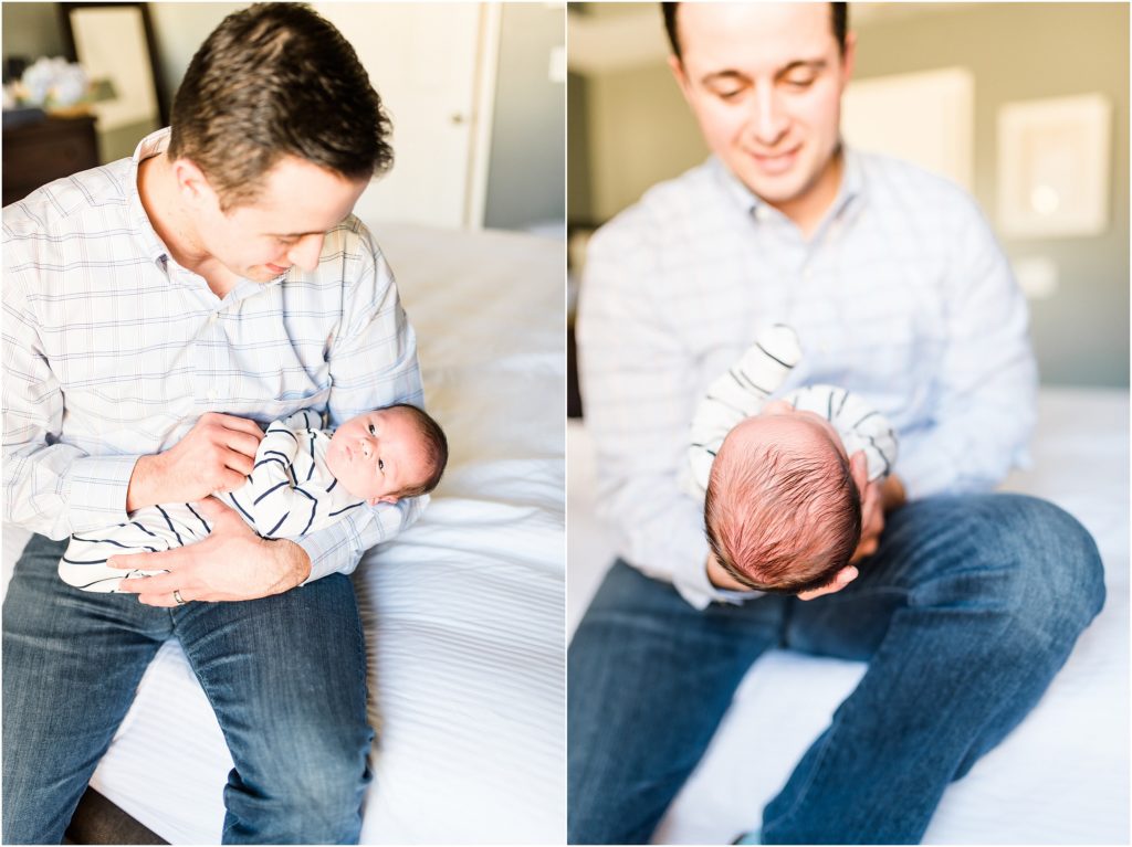 young father holding newborn baby boy on his lap for newborn session
