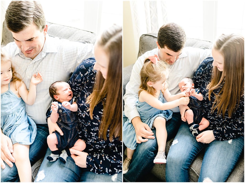 family sitting on couch with newborn baby boy