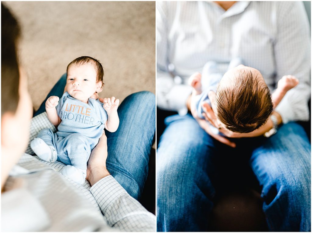 baby boy on dad's lap in chair for columbia, mo newborn session