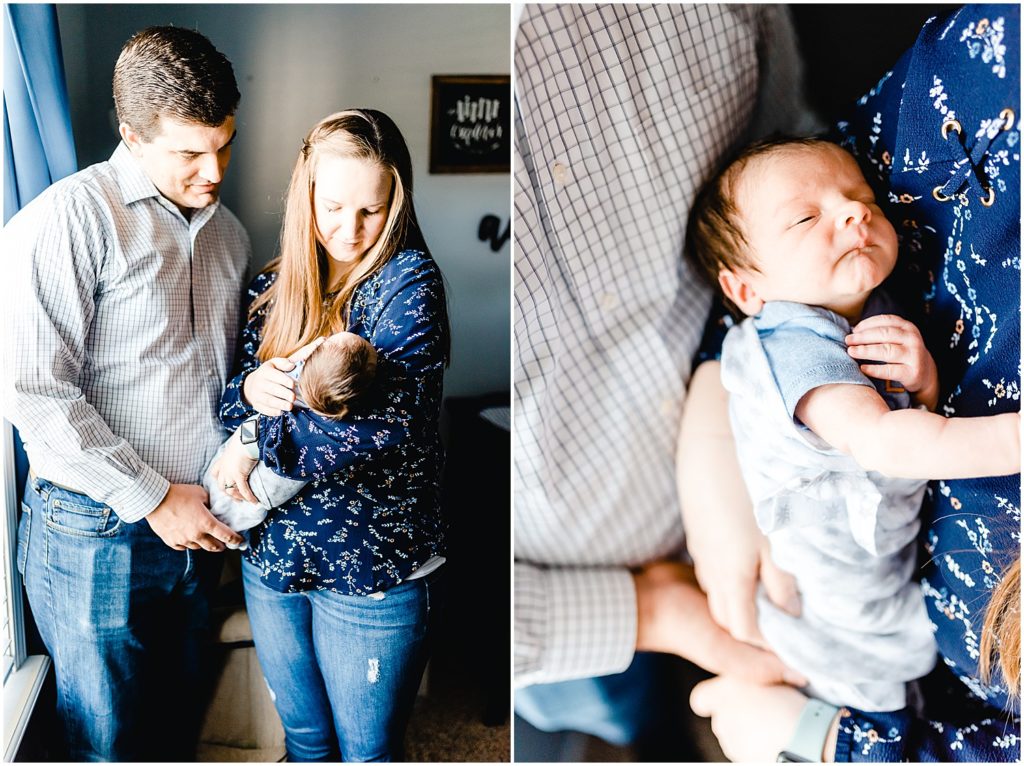 mom and dad holding baby boy by window for columbia, mo newborn session
