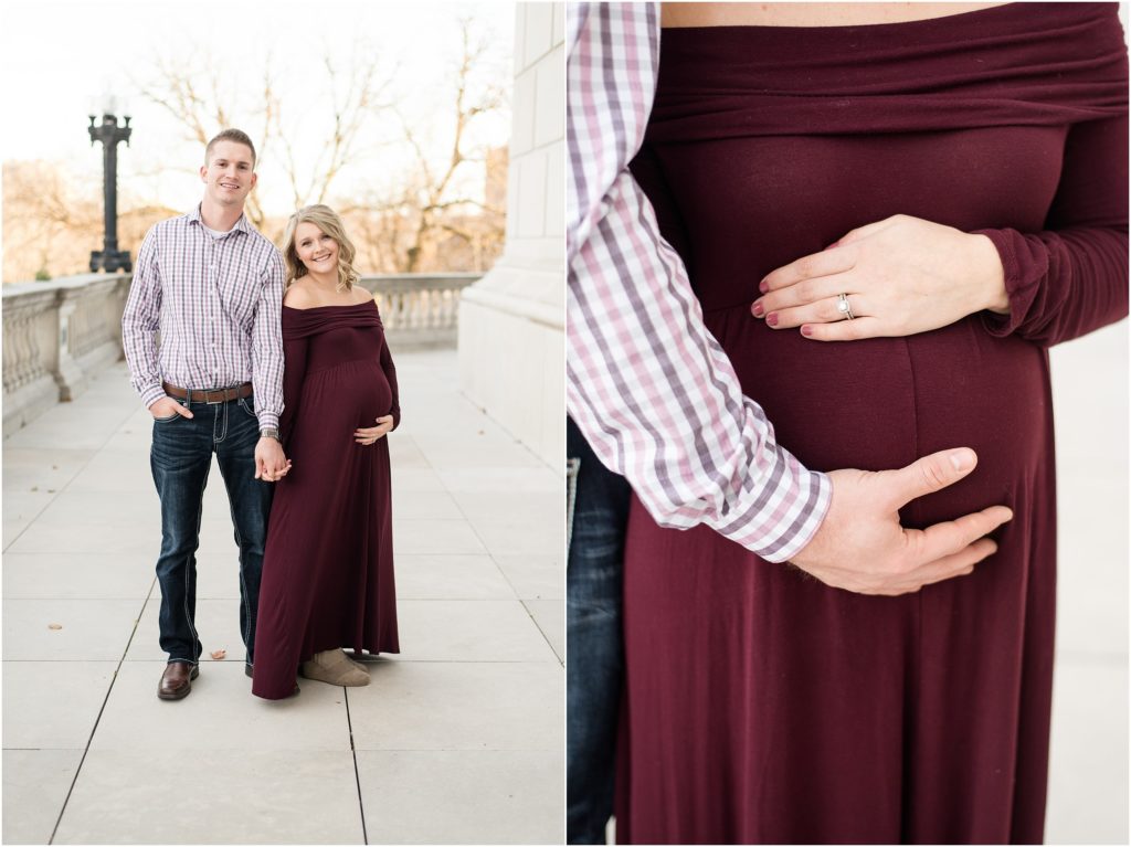 up close of couple holding baby belly in maroon dress during maternity session