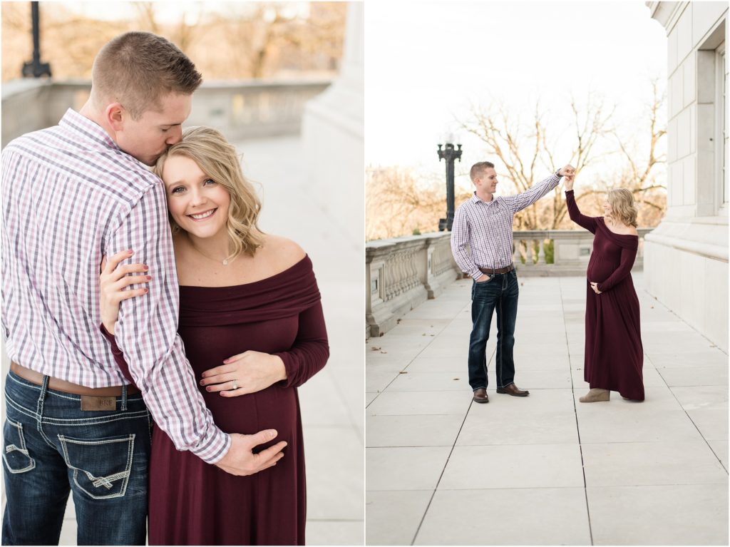 couple holding belly and spinning at missouri state capitol building for maternity session