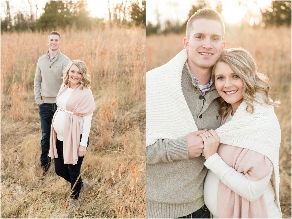 couple smiling at camera during sunset in grass field at binder park maternity session