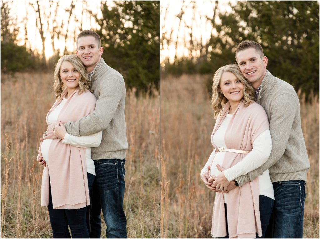 couple holding baby belly in tall grass during binder park maternity session