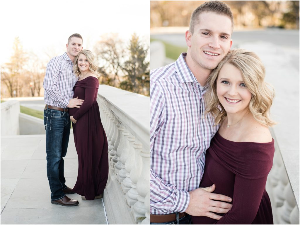 couple wearing maroon posing for maternity session at missouri capitol building