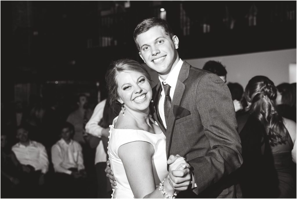 black and white image of bride and brother dancing at millbottom wedding reception