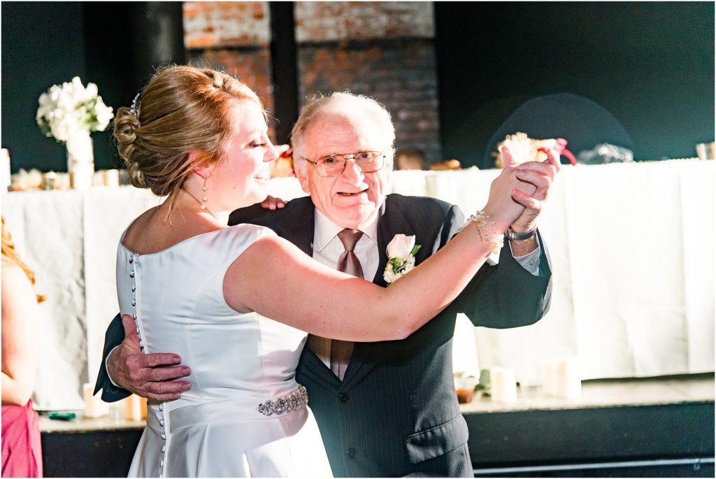 bride and grandpa dancing during wedding reception at millbottom