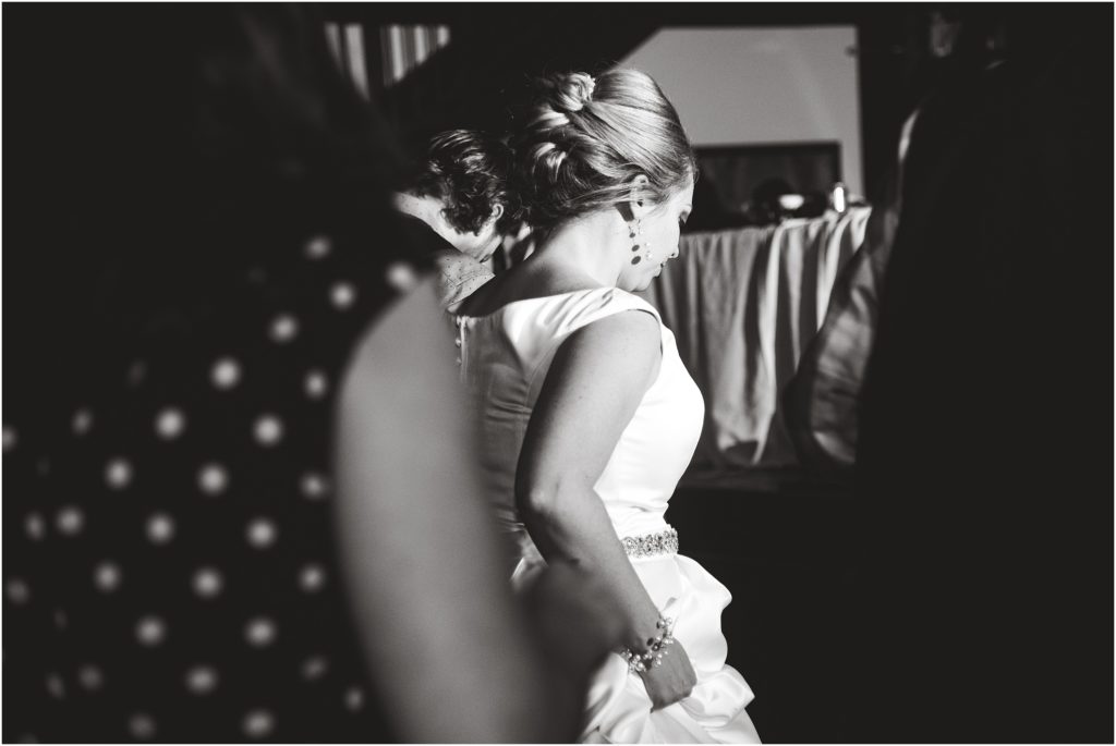 black and white image of bride dancing at wedding reception at the millbottom
