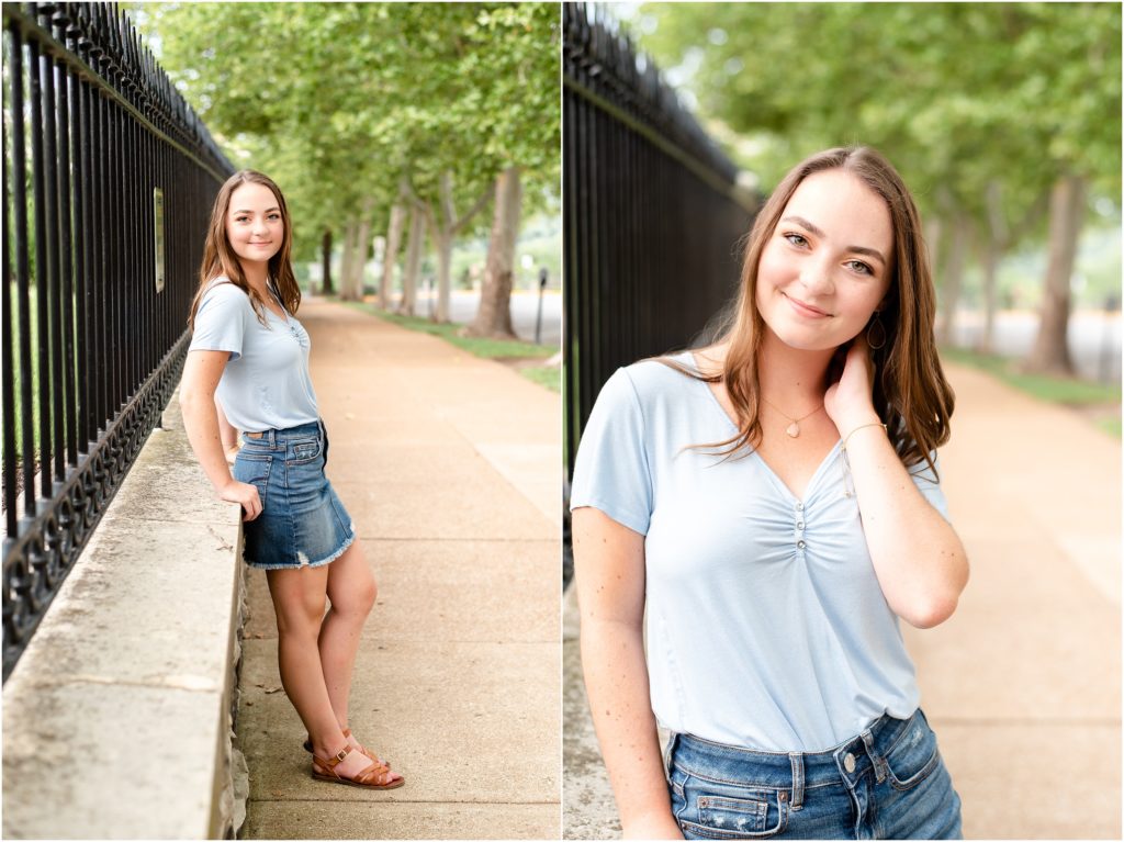 senior girl leaning against concrete wall for senior photos outside of Missouri governor's mansion in downtown Jefferson City, mo
