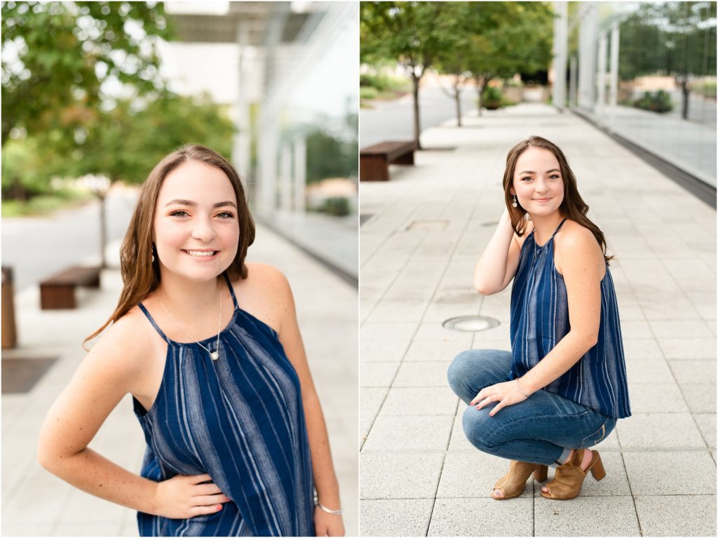 senior girl squatting on sidewalk wearing blue halter top for downtown Jefferson City high school senior session