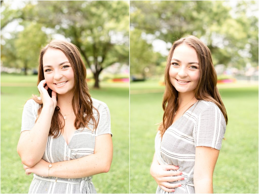 senior girl in black and white dress smiling for camera for senior photos