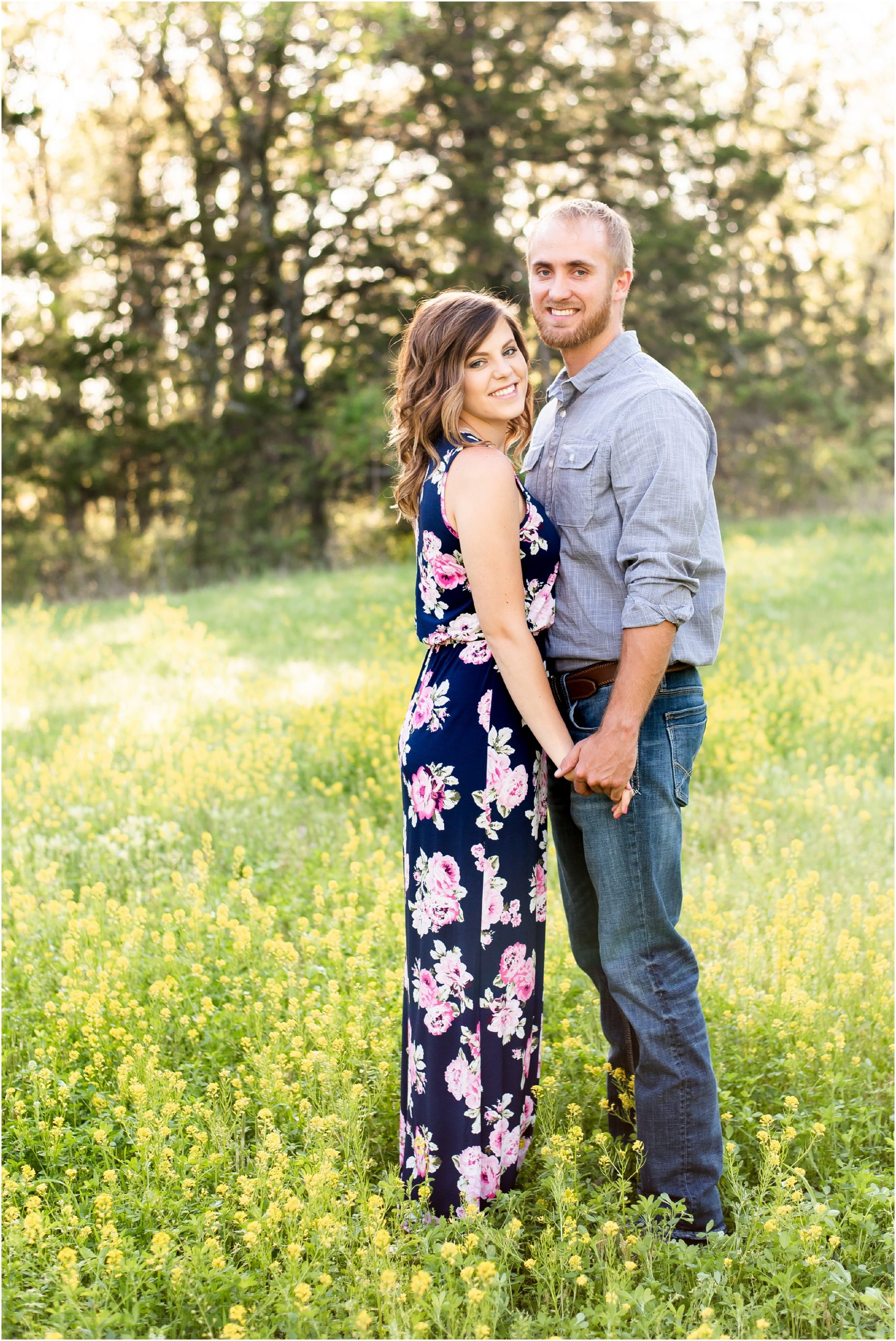 couple holding hands in yellow wildflower field for linn, mo couples portraits