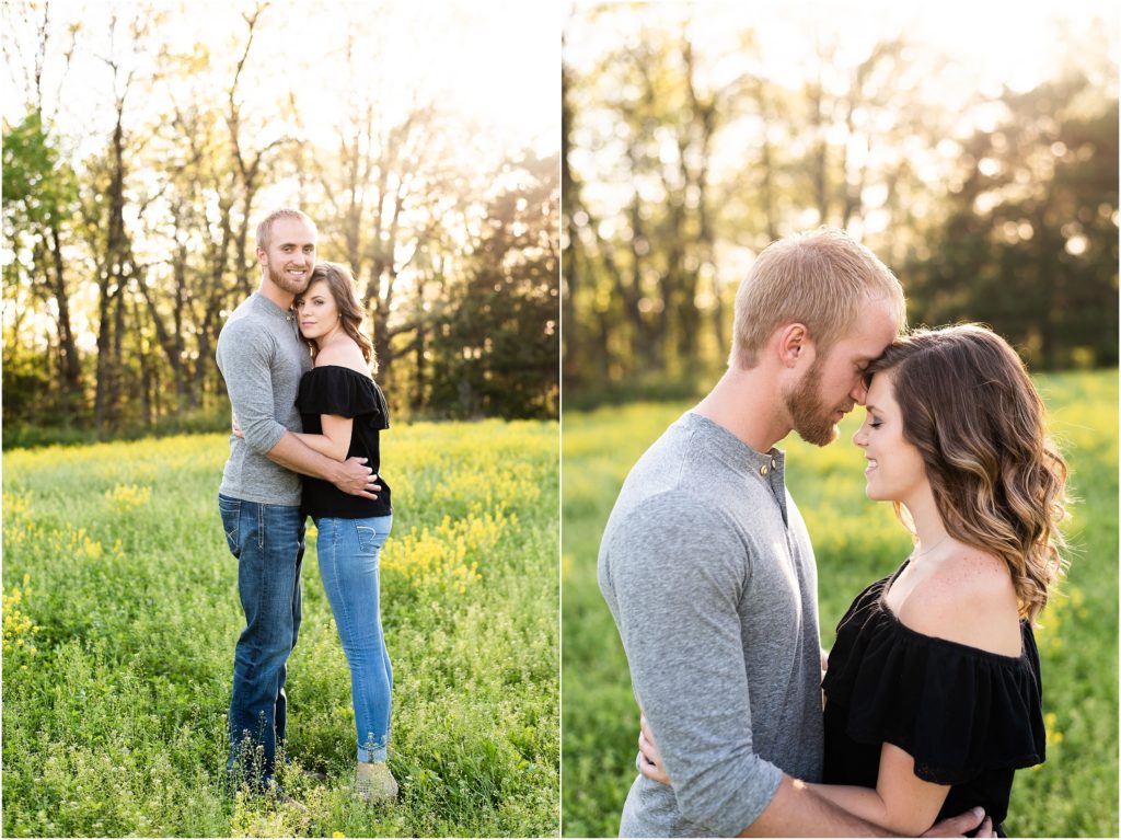 couple touching foreheads and smiling in field for couples session in Linn, MO