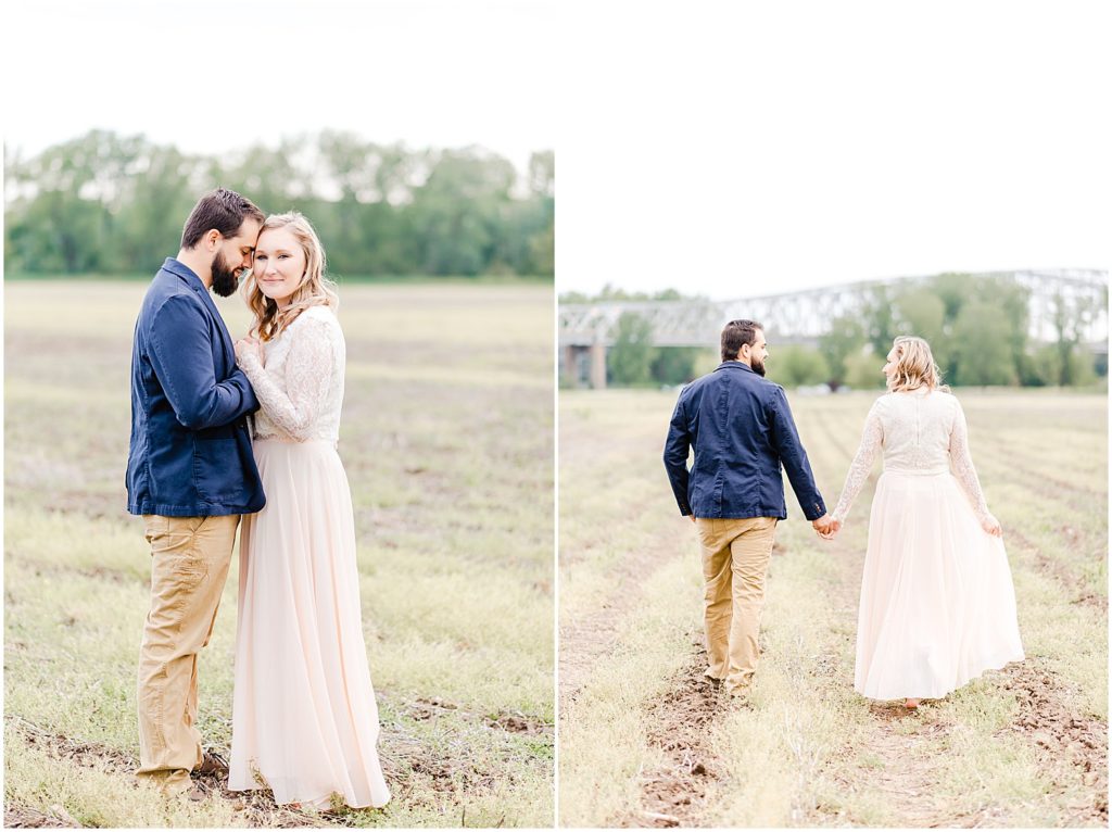 husband and wife standing together in field for anniversary portraits