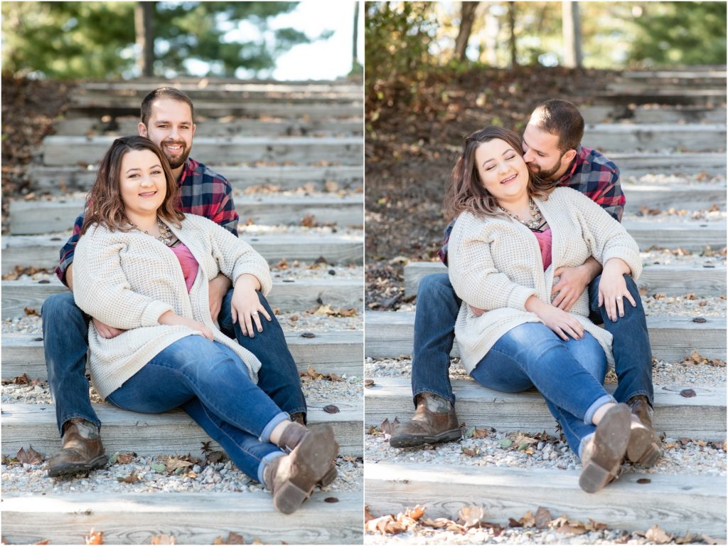 couple sitting and kissing on stairs for engagement session