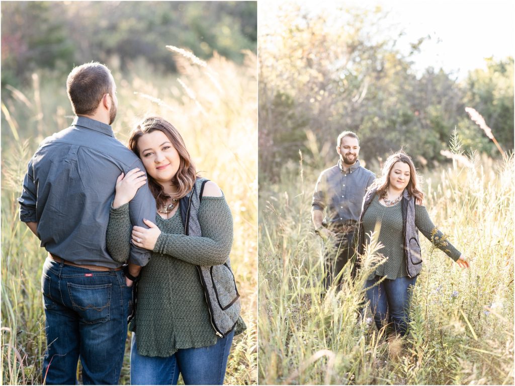 engaged couple walking through the tall grass 