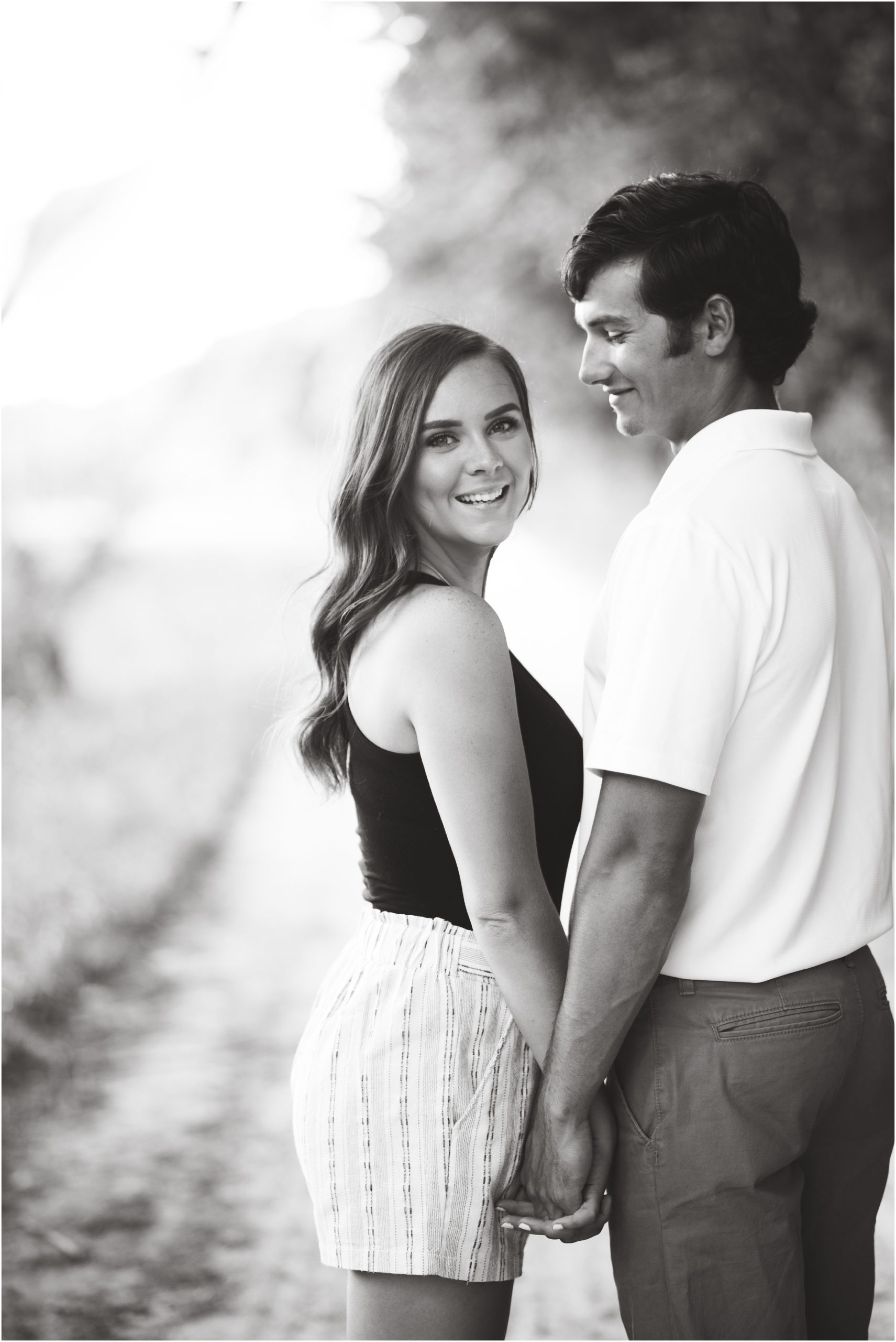 black and white image of engaged couple smiling for jefferson city engagement session