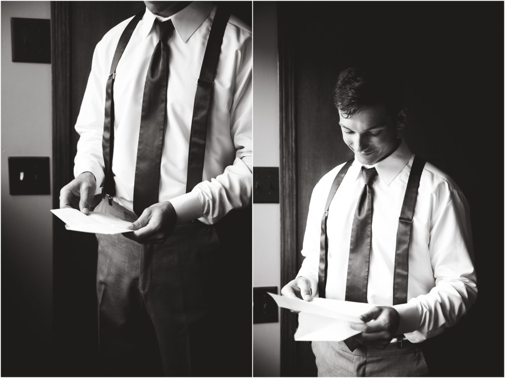 black and white image of groom reading letter