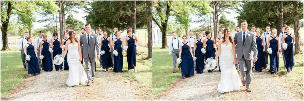 bridal party walking in tree lined lane