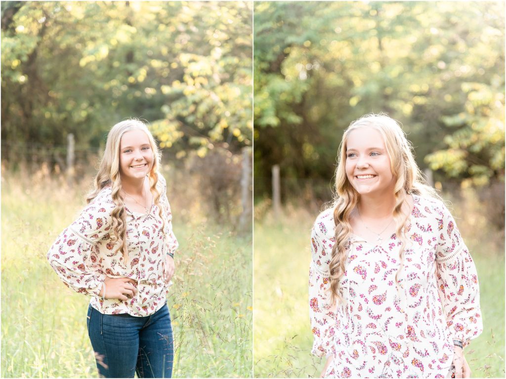 senior girl posing and laughing for senior session on farm in tall green grass