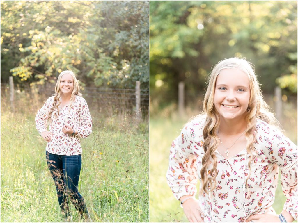 blonde senior girl in floral shirt and skinny jeans posing in a field for high school senior session