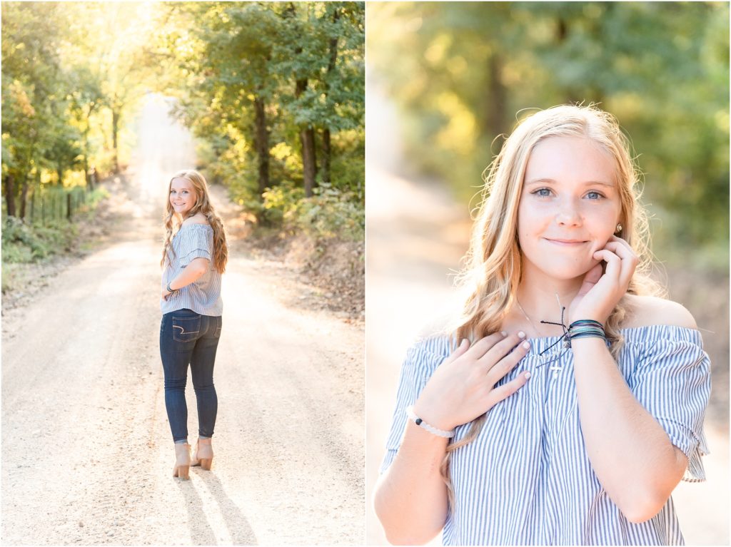 senior girl in blue off the shoulder shirt posing on gravel road in sunlight for russelville high school senior session