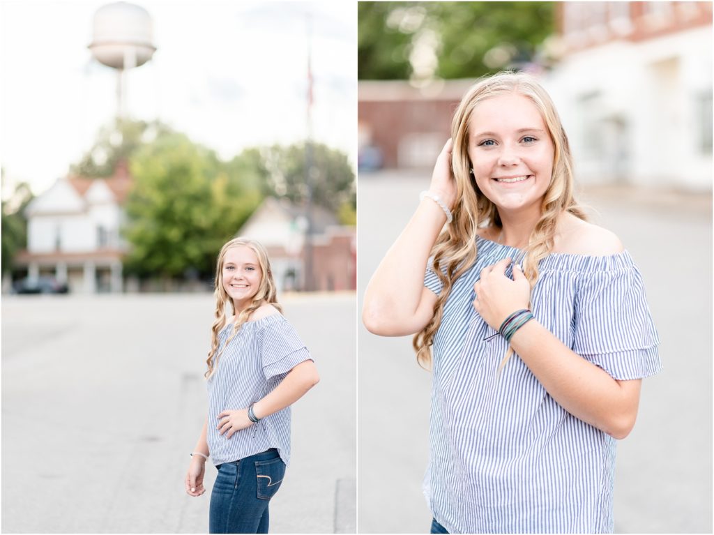senior girl posing in downtown Russellville, mo for senior session with water tower in background