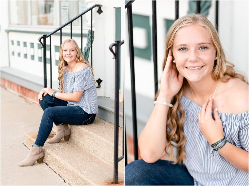 senior girl posing on steps with metal railing in blue off the shoulder shirt for Russellville high school senior session by Amanda Musselman Photography