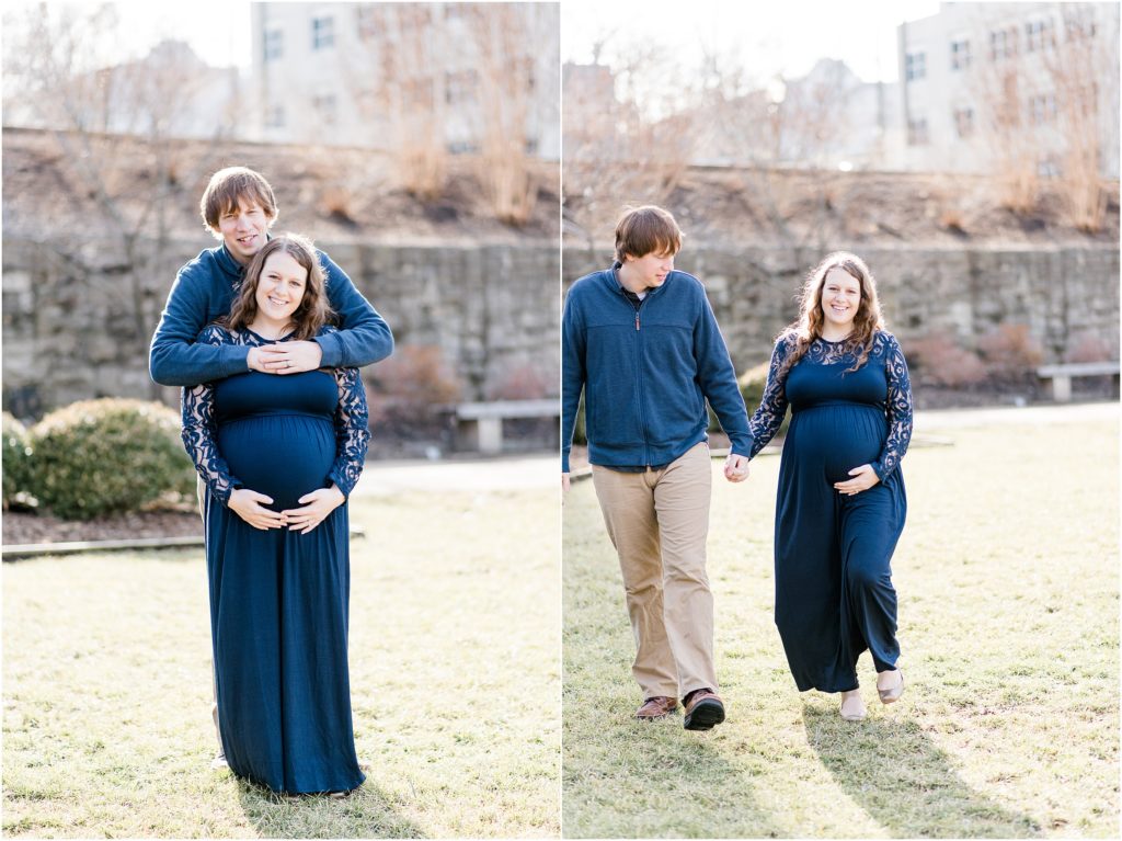 maternity session for couple wearing navy walking on the grass