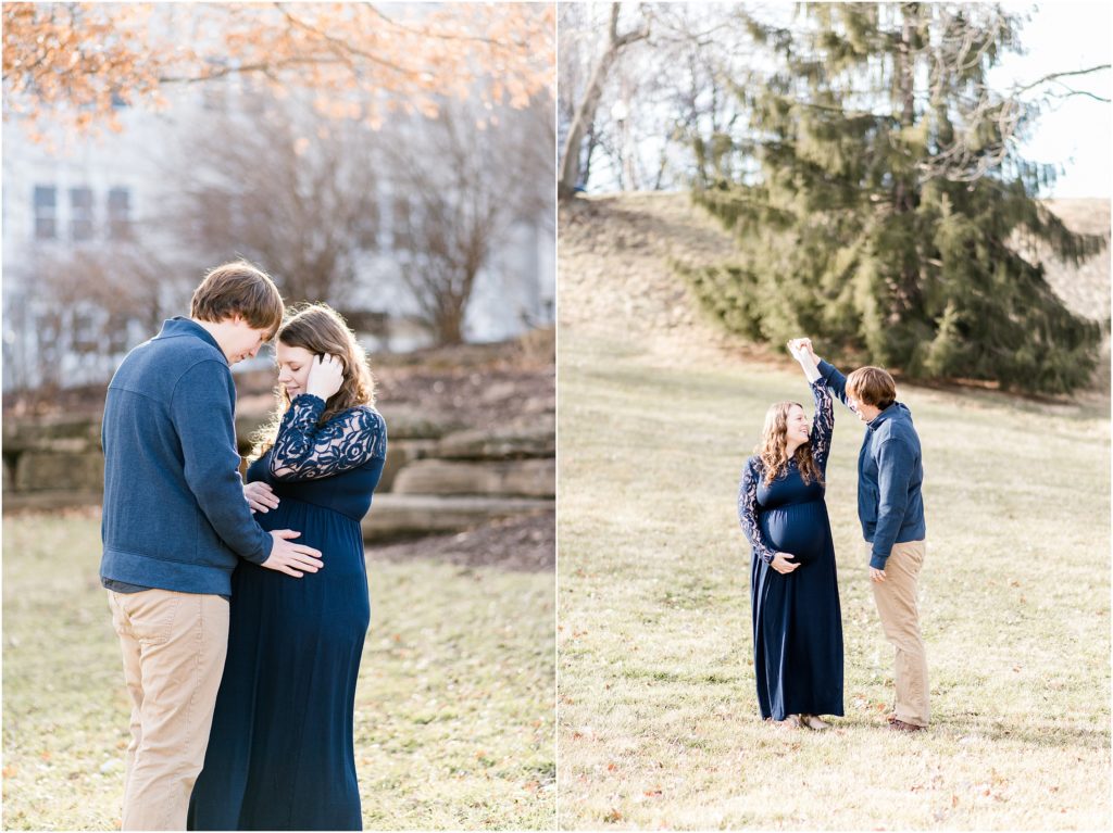 maternity session of couple on grass spinning and looking at belly