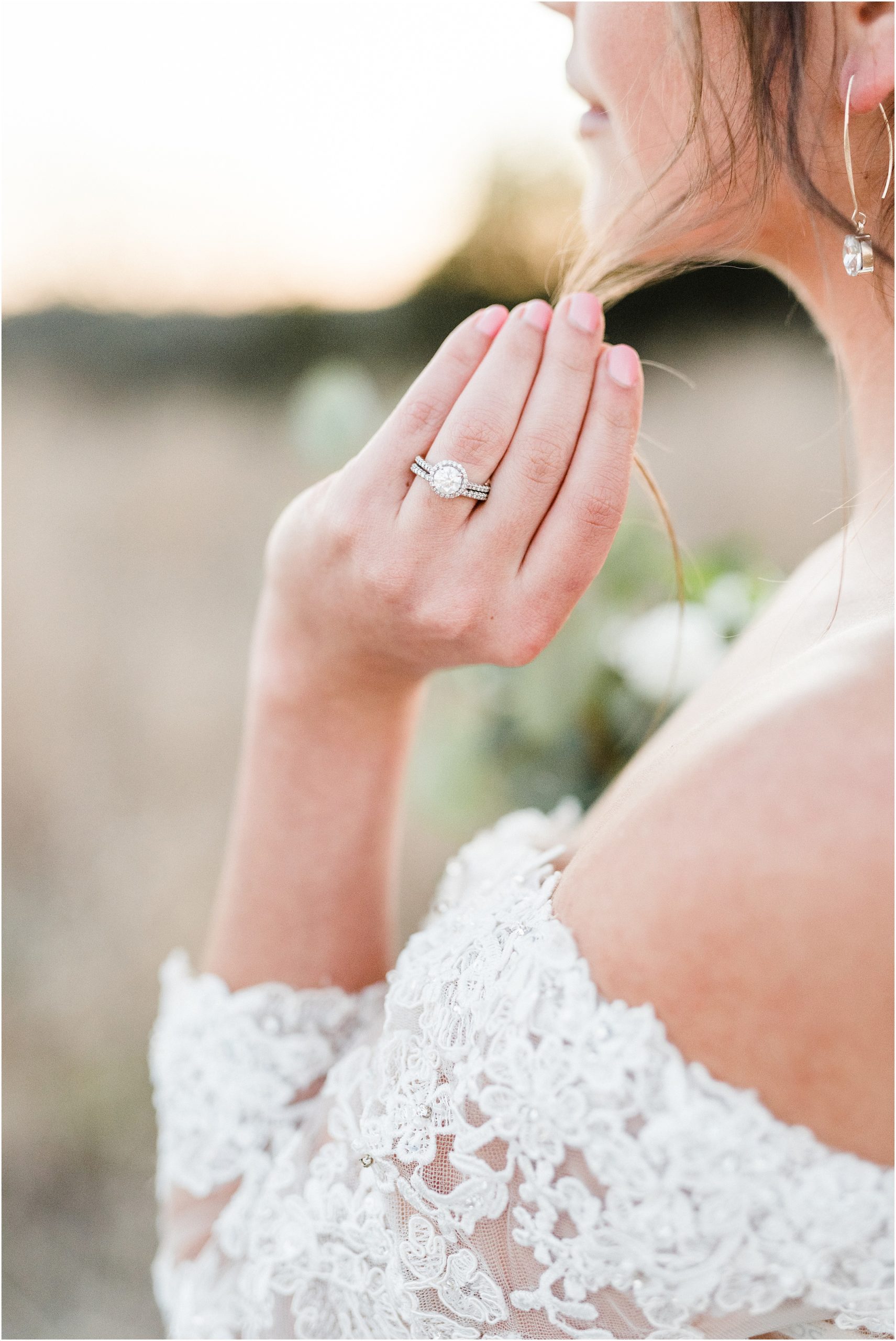 detail shot of engagement and wedding ring during bridal session at sunset