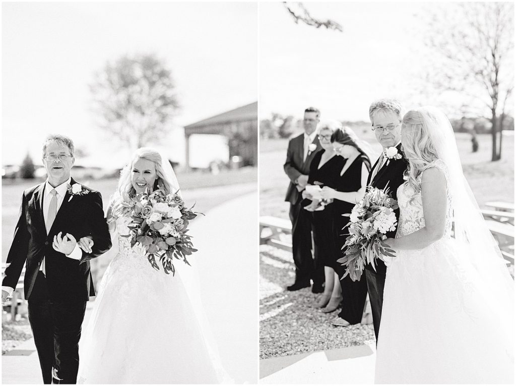 bride and dad walking together down aisle on wedding day