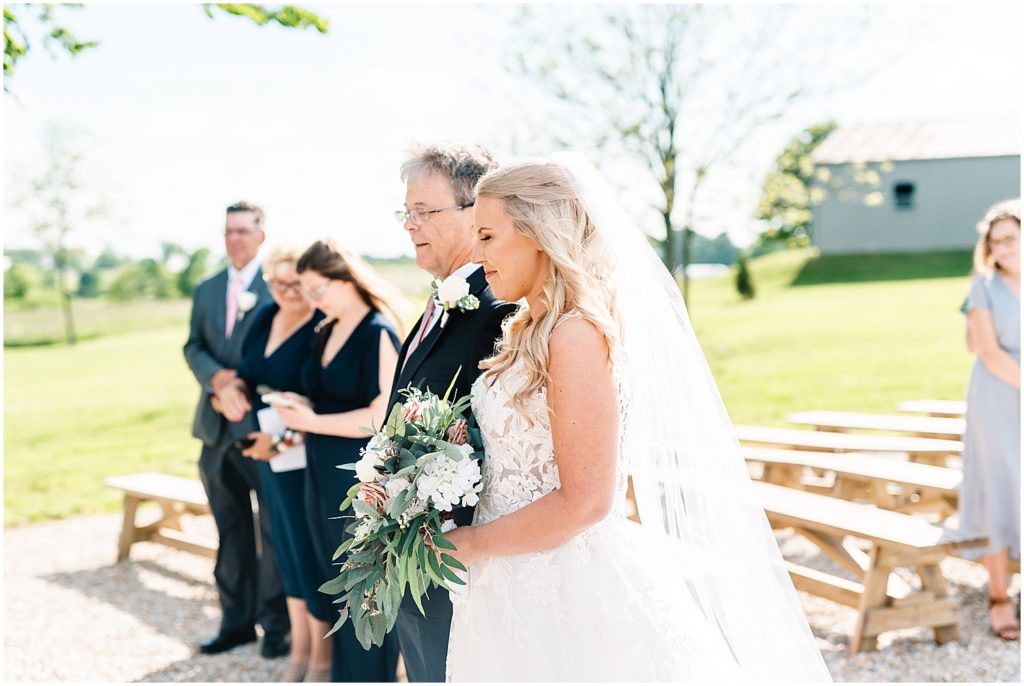 bride and dad standing at the top of the aisle for wedding ceremony