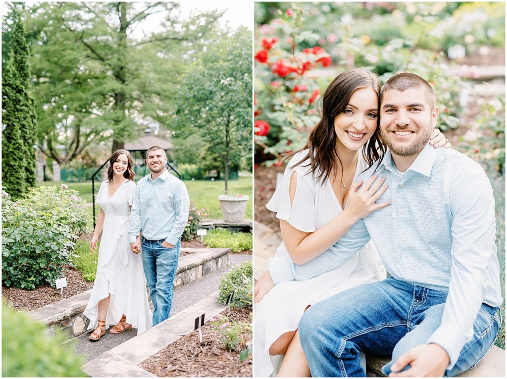 couple walking in rose garden smiling during engagement session