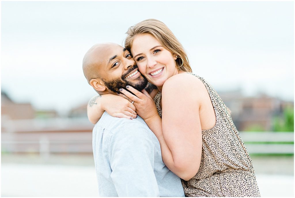 man holds his fiance for engagement photos