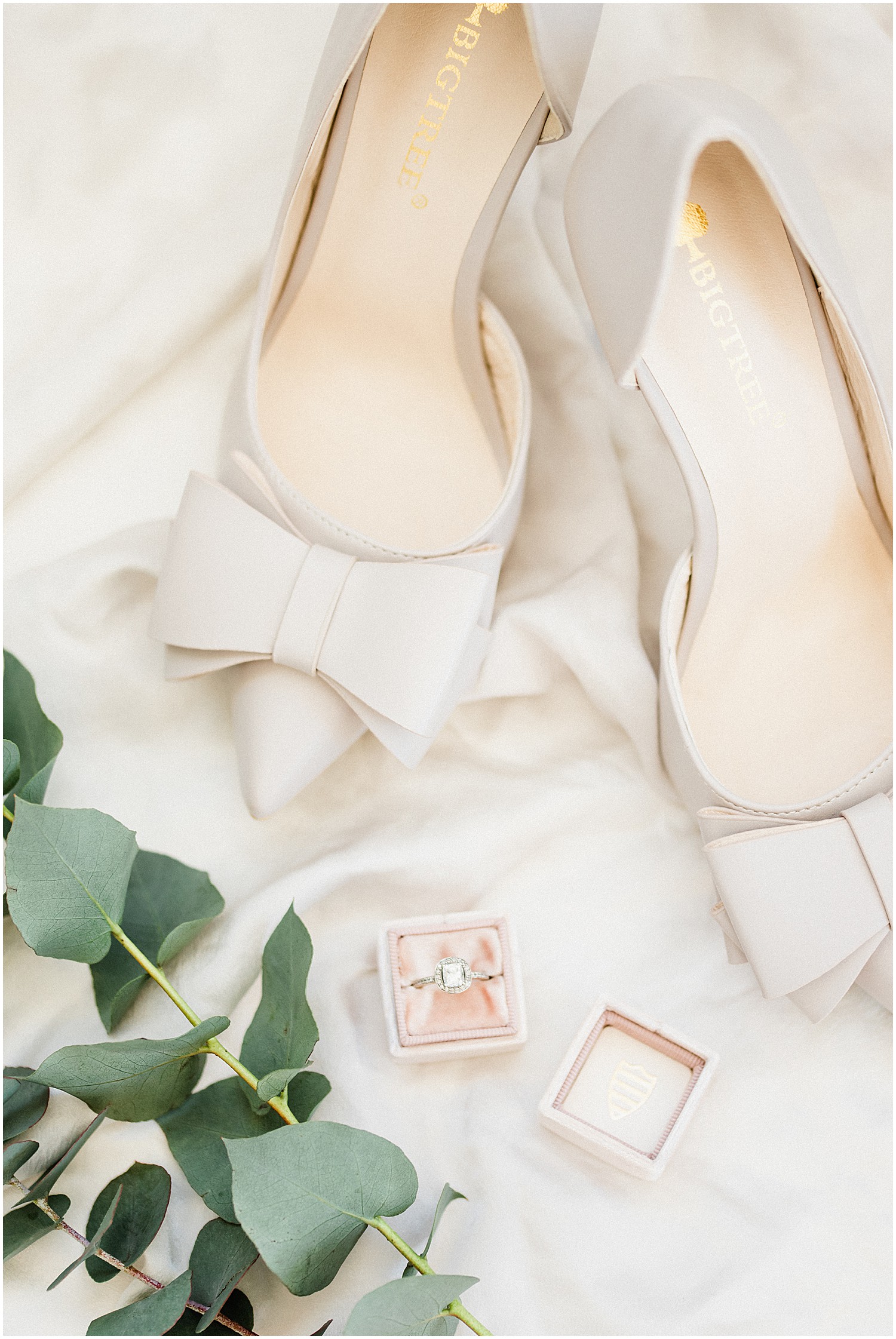 ivory wedding heels featuring bows on an ivory silk background