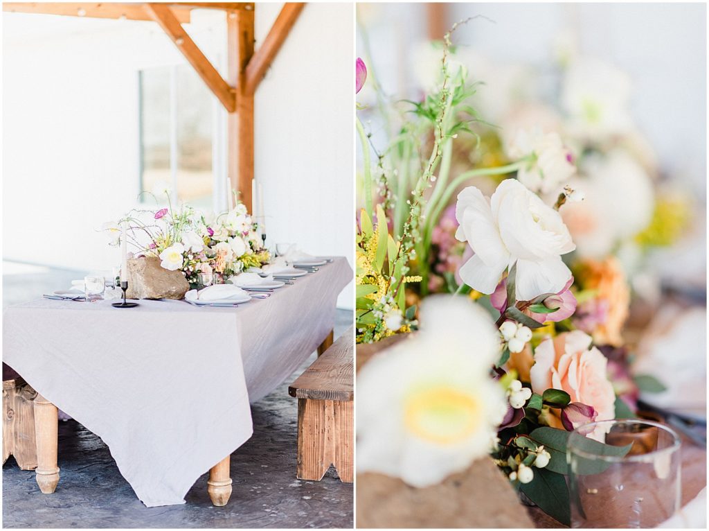 a farm table covered in lavender linens topped with bright florals