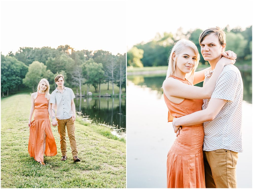 young engaged couple walks and poses for photos near a lake at kempkers back 40 missouri wedding venue