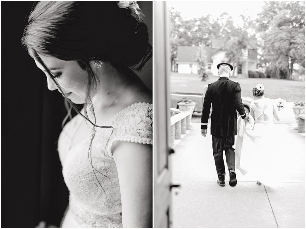 black and white image of bride in doorway and groom holding her dress while walking in the rain after wedding ceremony