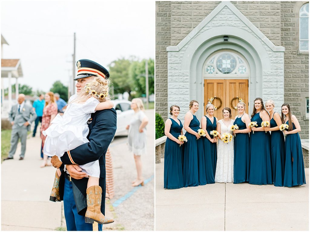 groom holds his niece while bridesmaids take pictures with the bride on wedding day outside of catholic church