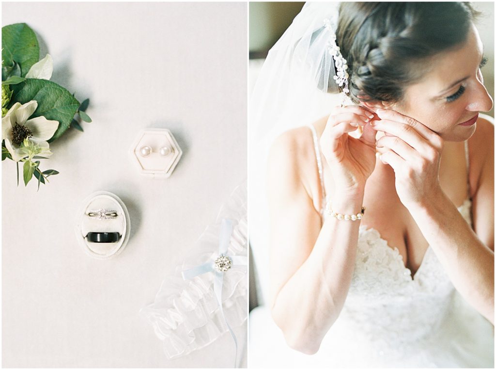 a bride puts on an earring while wearing her bridal gown on her wedding day
