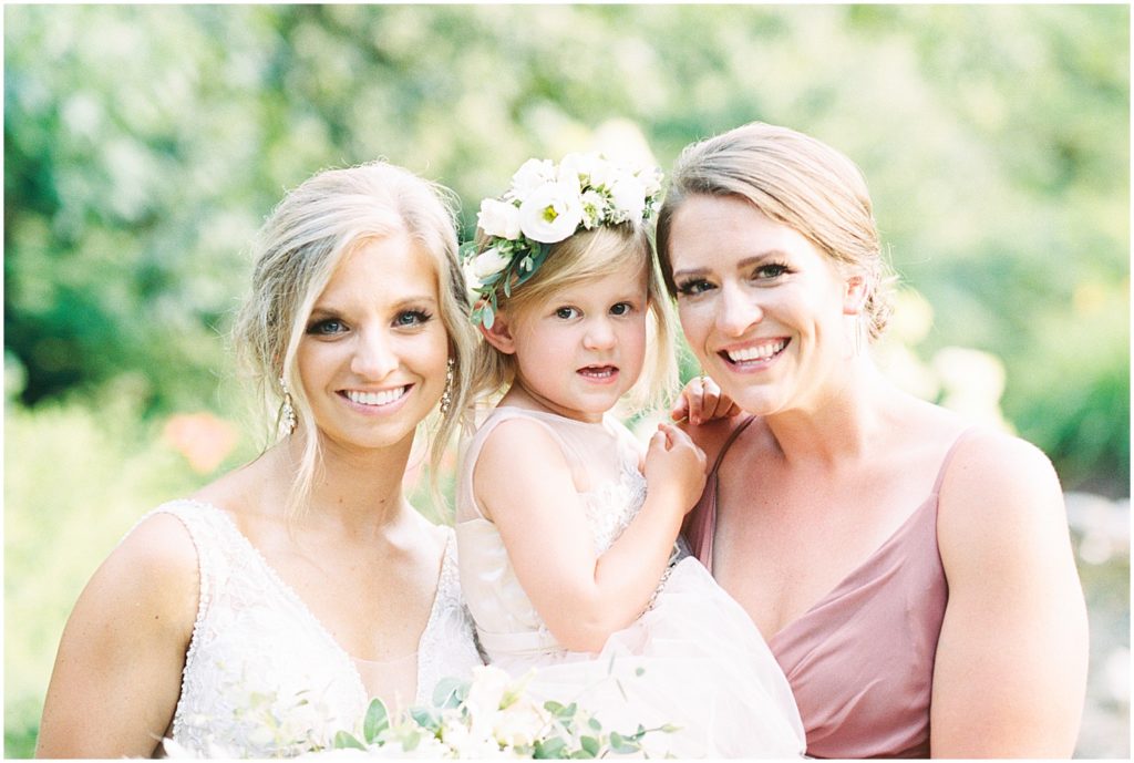portrait of bride with bridesmaid and flower girl on wedding day